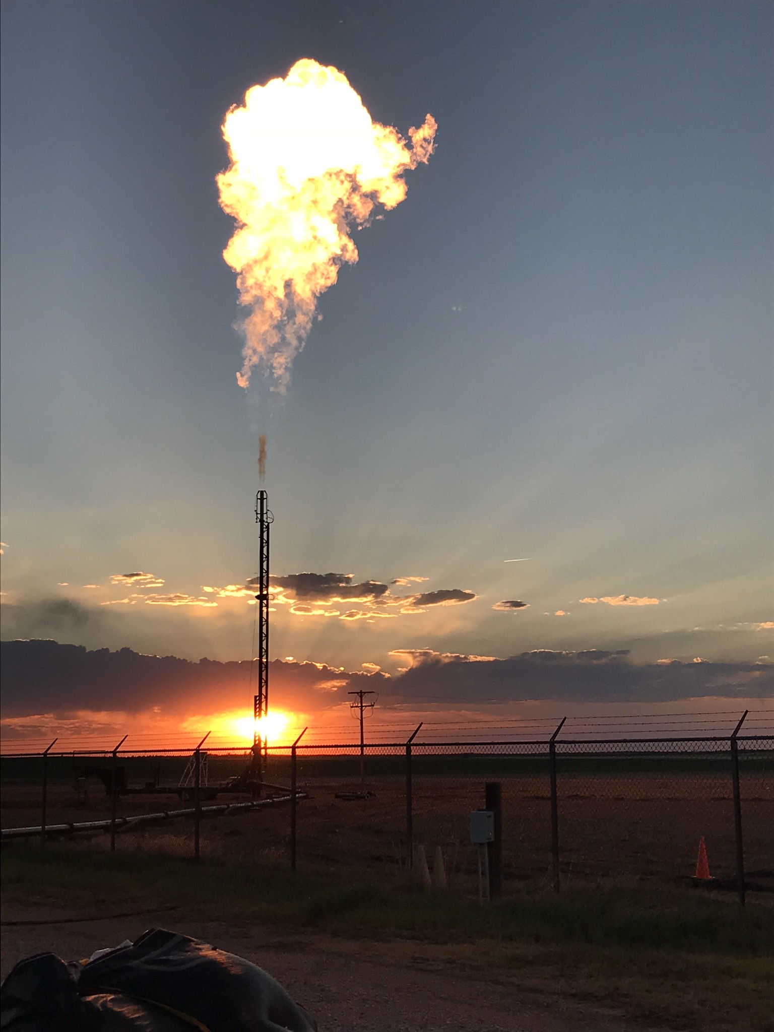 Wide shot of a flare firing in a pipeline blowdown operation Wide shot of a flare firing in a pipeline blowdown operation